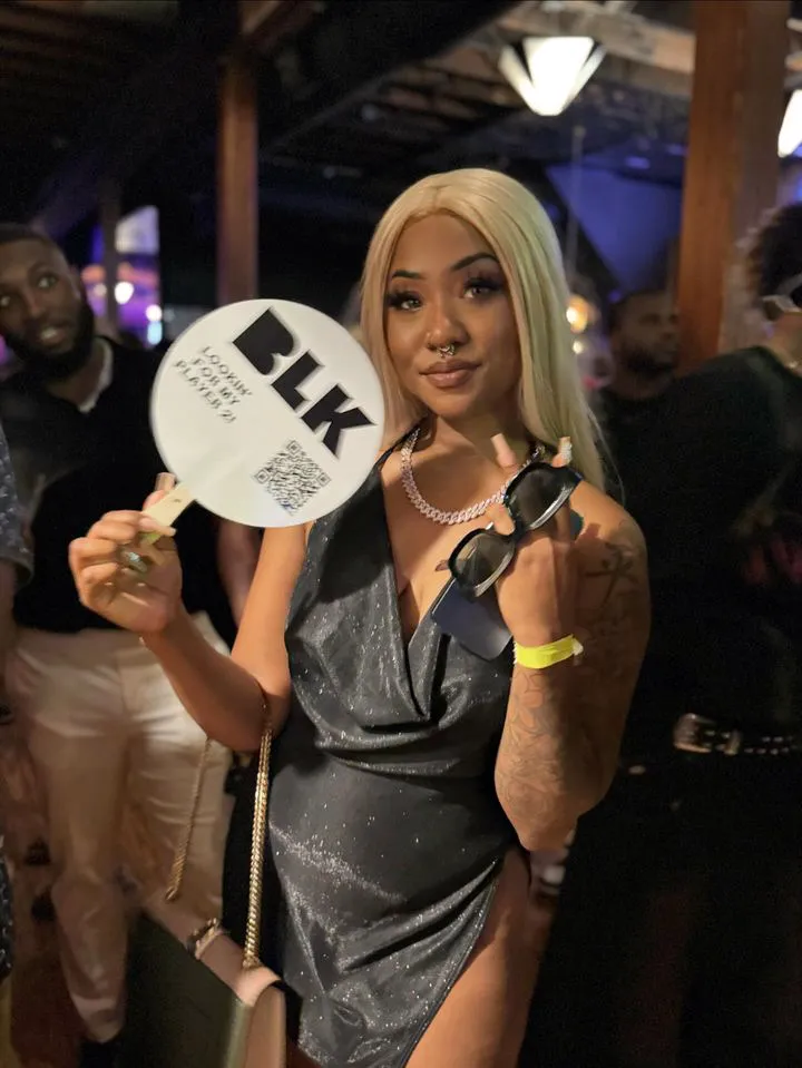 "Photo capturing a vibrant moment from the Blerd Party with an influencer promoting the BLK brand at the event, highlighting influencers who align with brand values through authentic connections and shared cultural resonance.