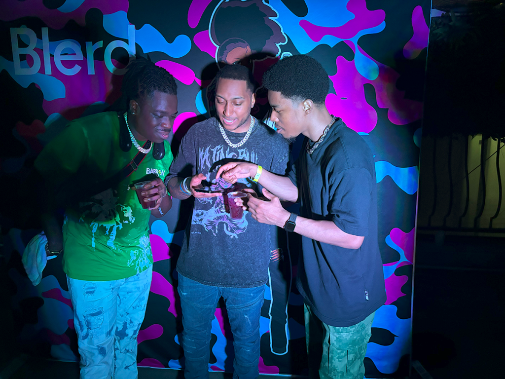 Cultural Innovation in Marketing: AI, UGC, and Experiential Events 1 Influencers at an experiential event by Blerd creating UGC