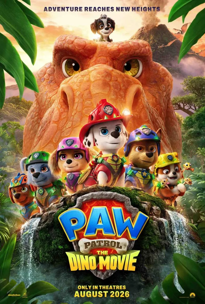 PAW Patrol The Dino Movie official movie poster featuring the pup squad on a tropical island with an orange dinosaur and a volcano erupting in the background